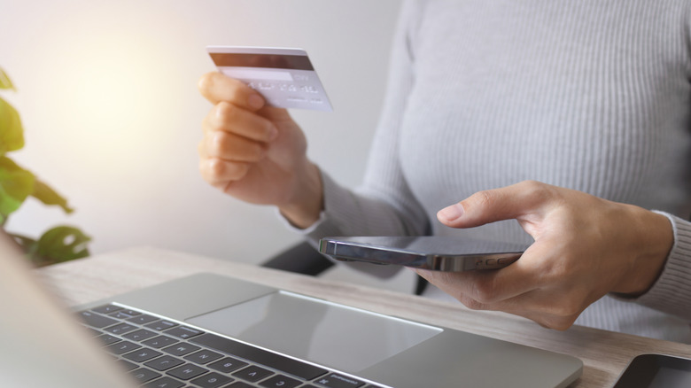 woman paying online using laptop