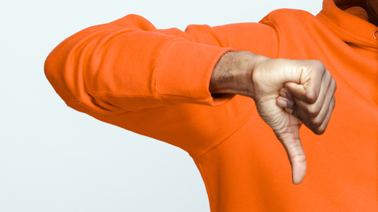 hand showing the thumbs down gesture