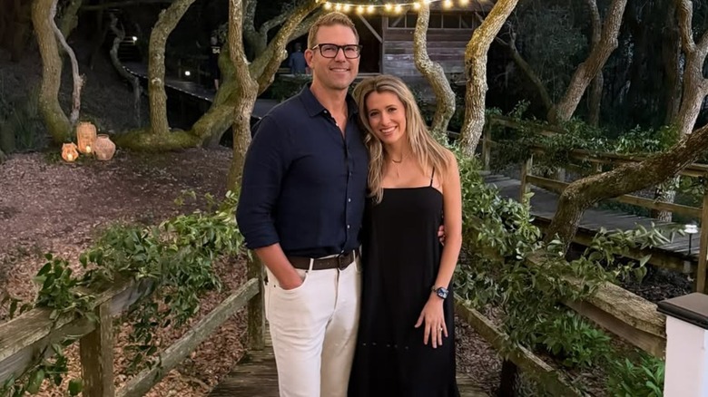 Travis Stork posing with his wife