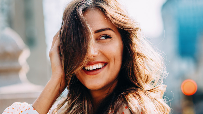 Woman touching hair