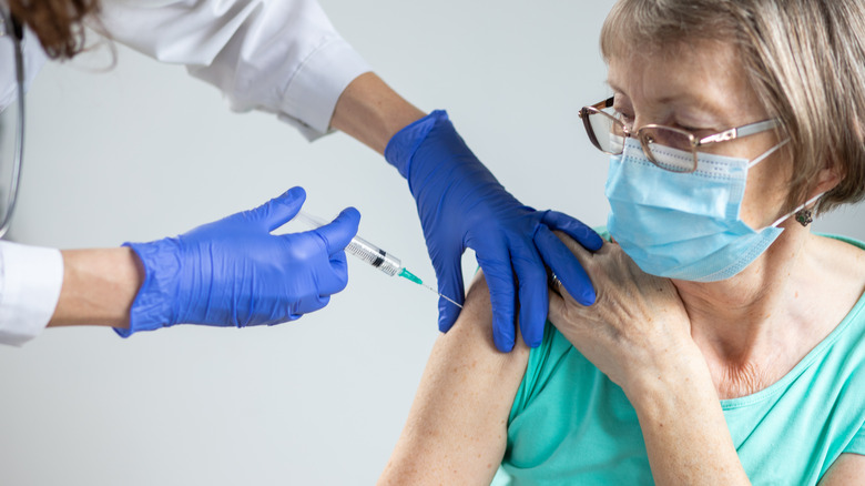 older woman getting vaccinated