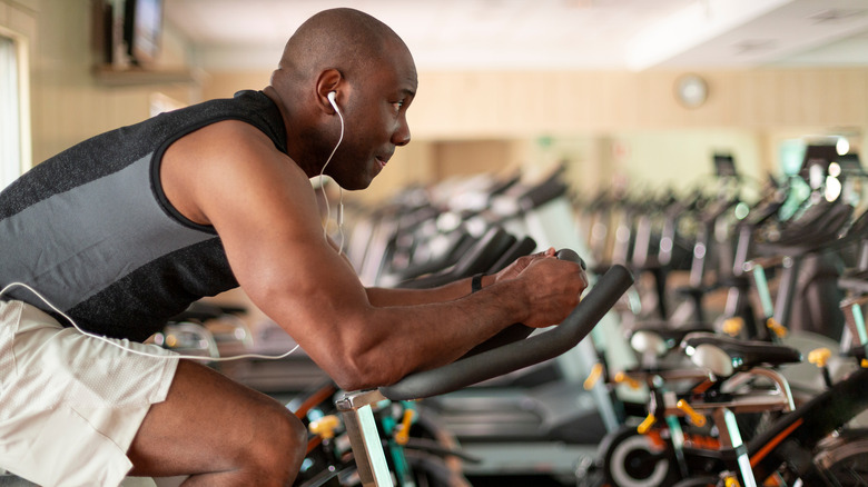 Black man exercising on stationary bike
