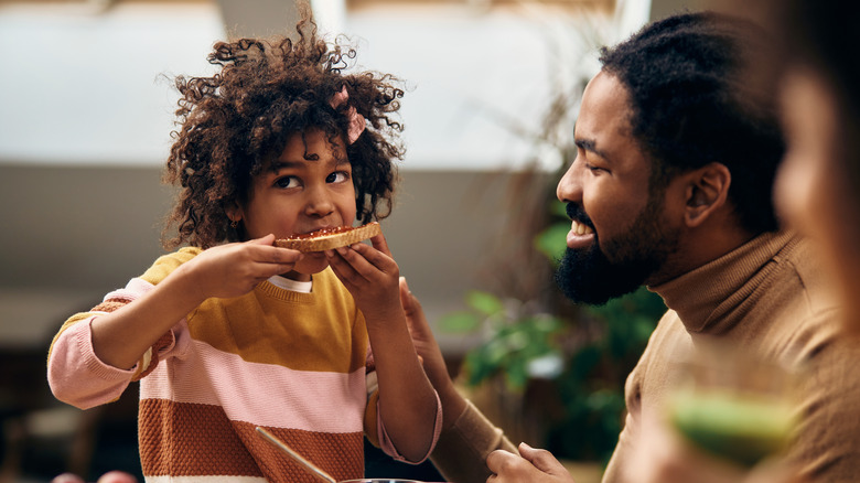 girl eating toast