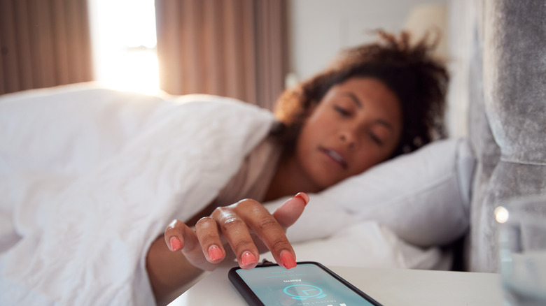 Man wearing a smartwatch to track sleep