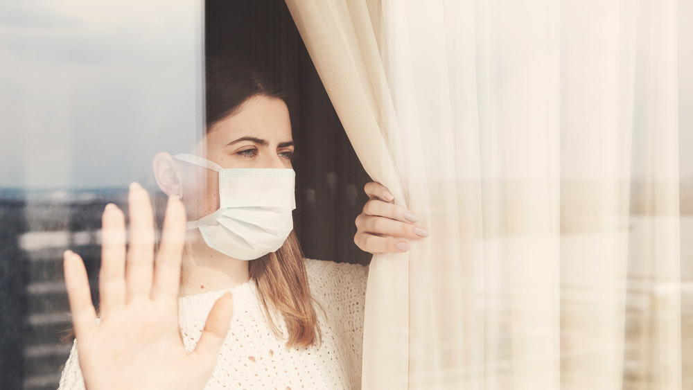 Woman looking out window