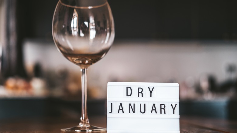 "Dry January" sign and wine glass