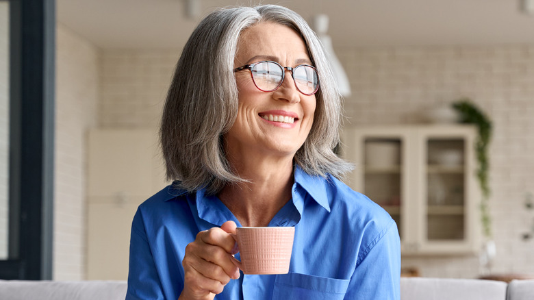 Older woman holding teacup