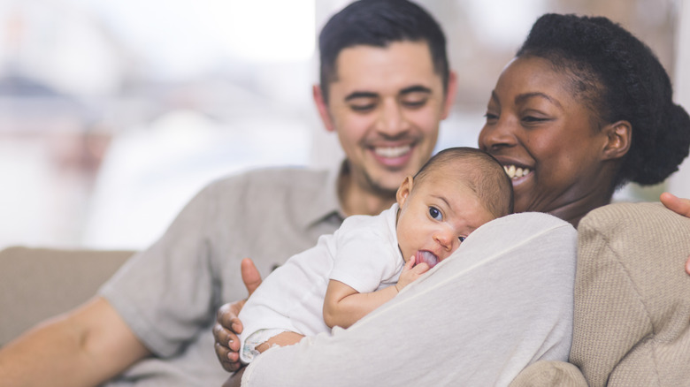 couple holding their baby