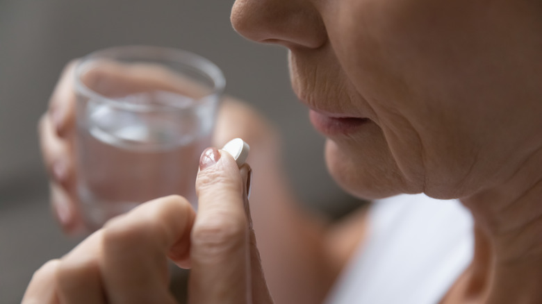 Woman taking pill