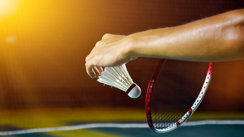 Badminton player with racket and shuttlecock