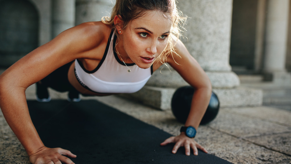 Woman doing push ups.