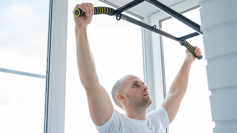 A man preparing to do a pull-up