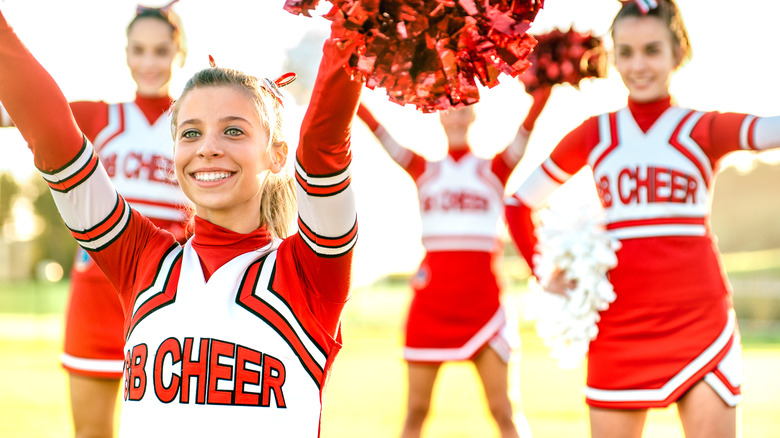 group of young girls in a cheerleading uniform 