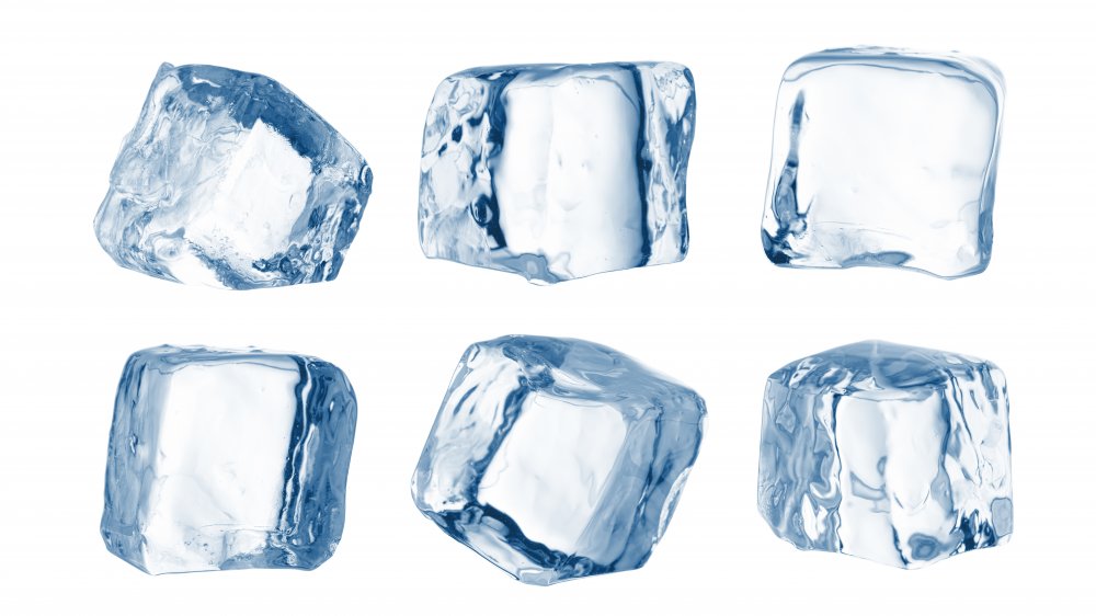 Six blue-tinted ice cubes