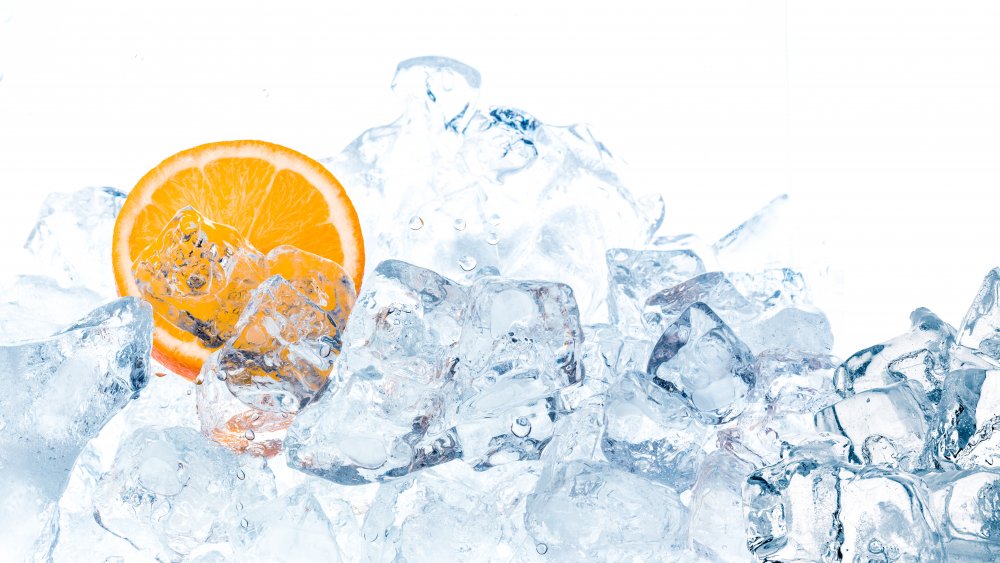 Orange slice in pile of ice