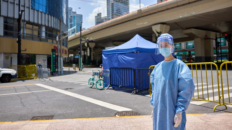 Medical worker in front of tent in China