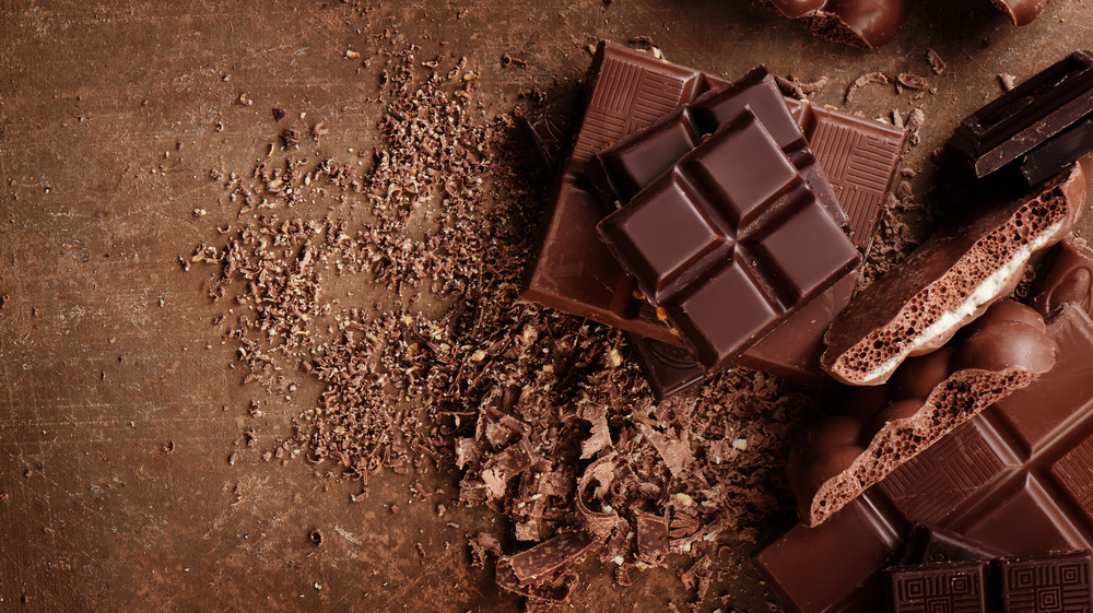 bricks of chocolate on a matching brown background 