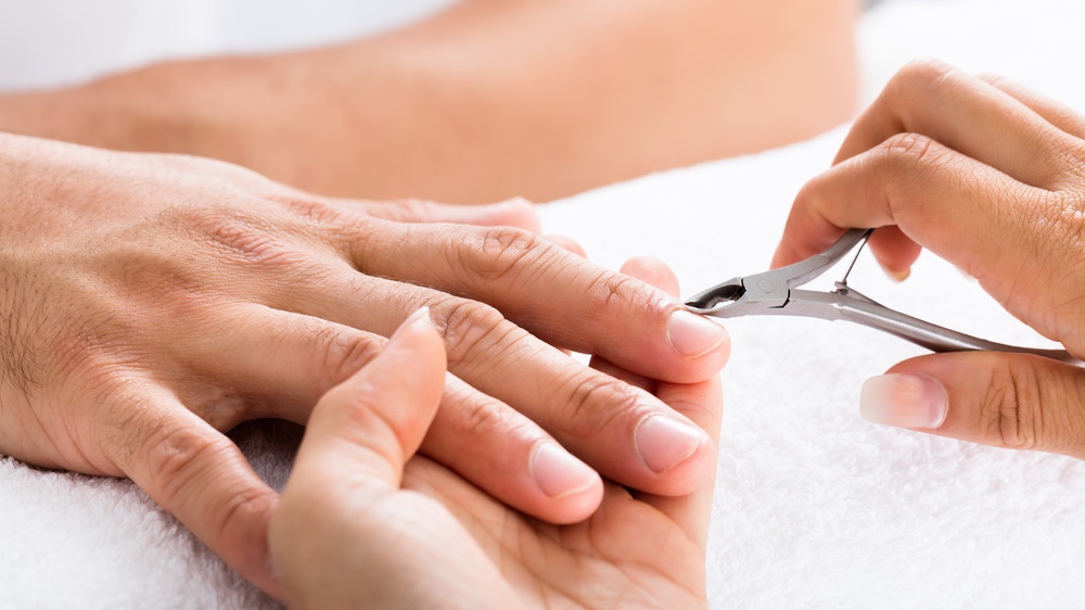 close up of getting cuticles cut  