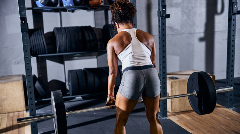 a woman doing a deadlift 