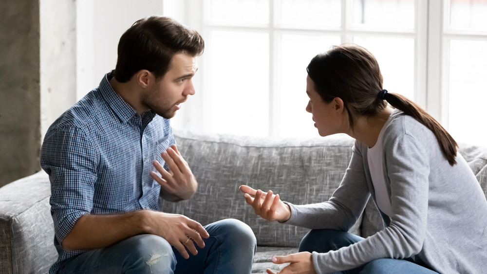 Couple arguing on the couch 