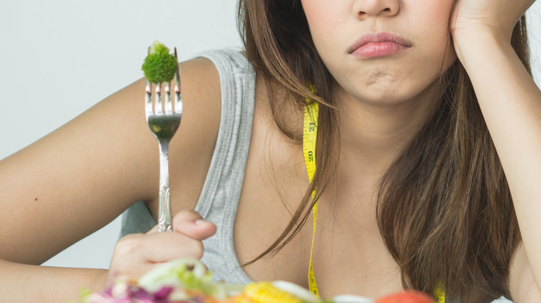 young girl struggling with diet