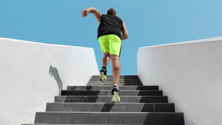 Man running up steps outside