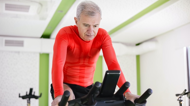 A man on a bike exercising