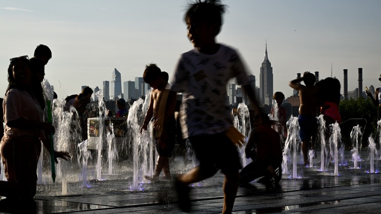 Children playing in fountain in New york