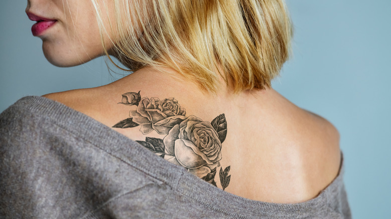 A woman with a back tattoo