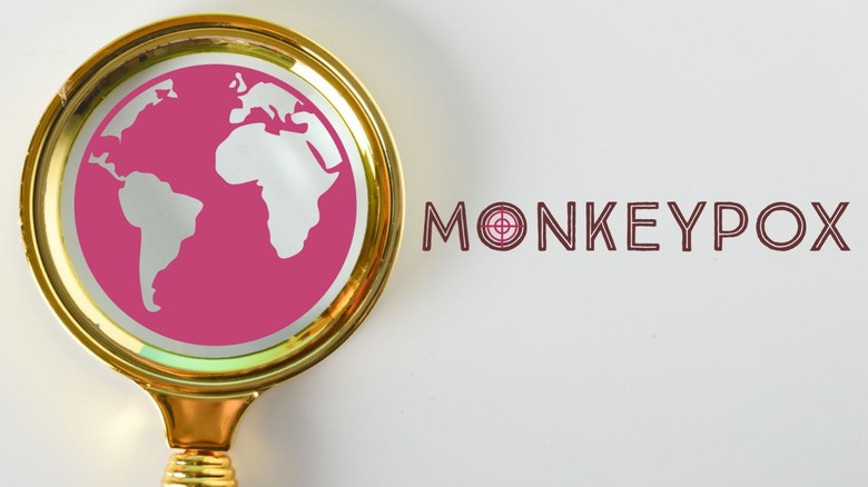monkeypox globe under magnifying glass concept