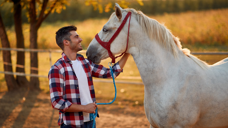 smiling man with horse