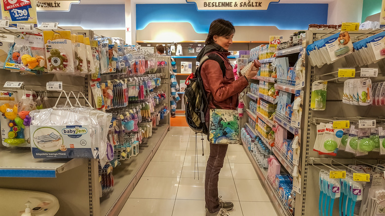 woman shopping for baby formula 