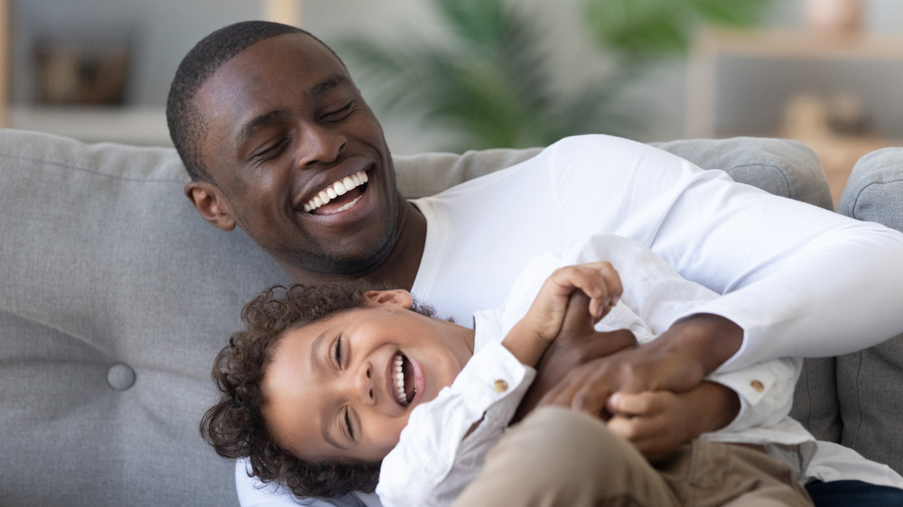 Parent tickling child 