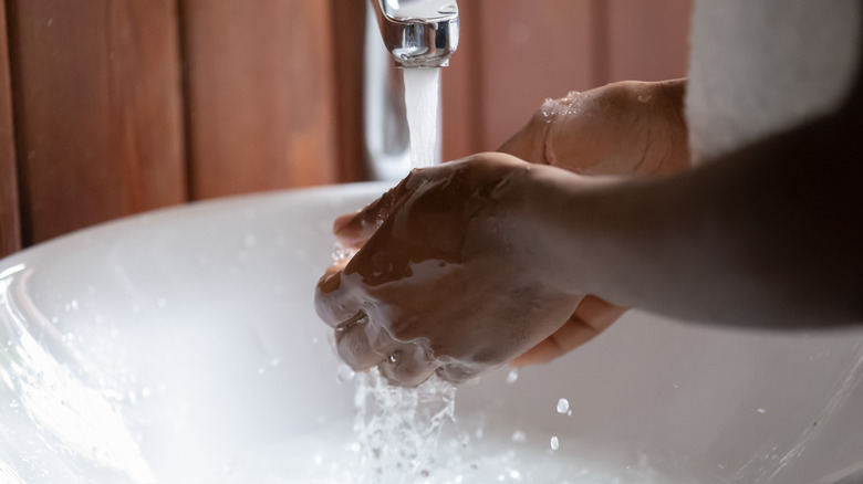 person washing hands
