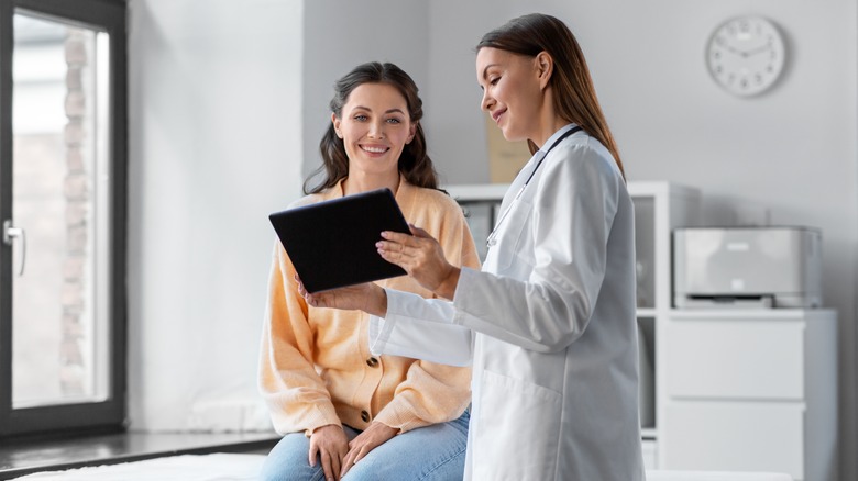 Woman talking to doctor