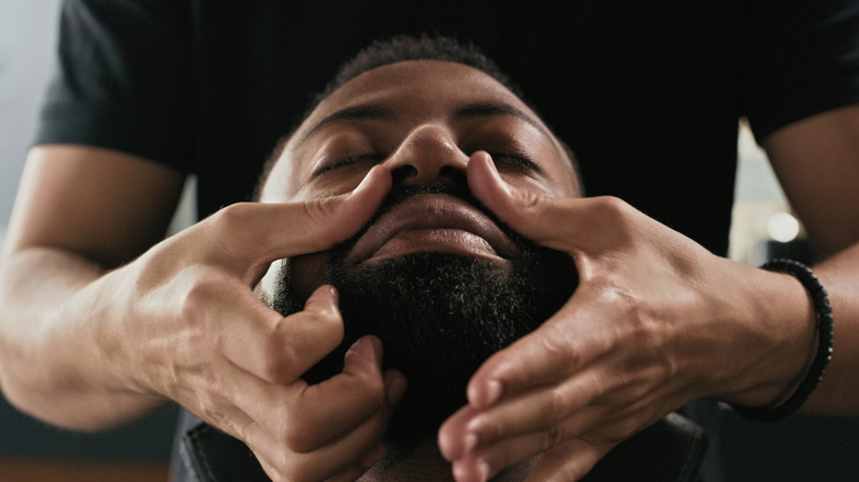 Man getting a beard massage