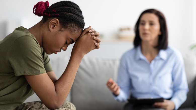 woman depressed in psychologists office