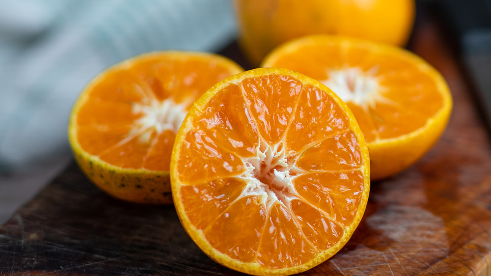 Sliced oranges on a cutting board 