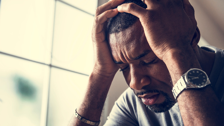 Distressed African American man