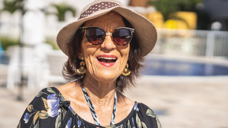 Smiling woman wearing sunglasses