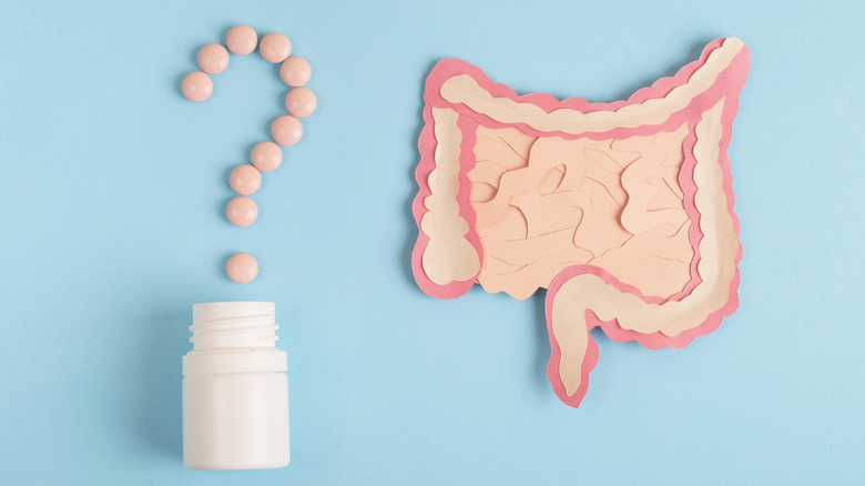 Pills in question mark and diagram