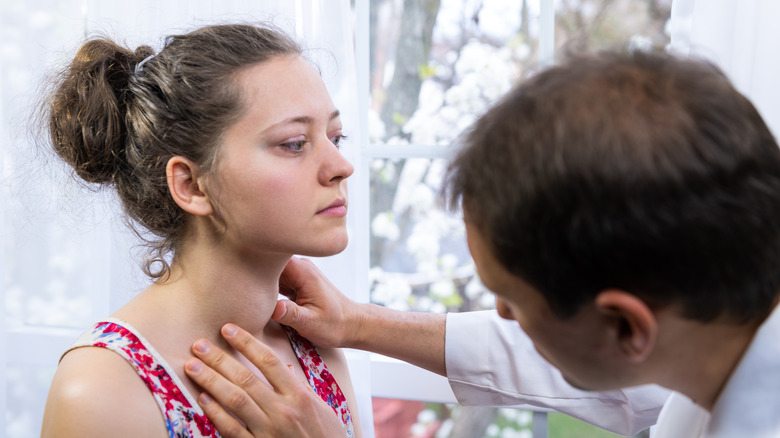 doctor examining patient