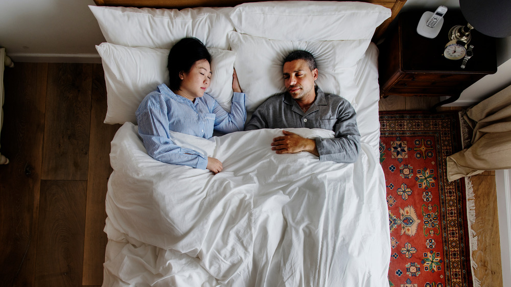 Interracial couple sleeping together 