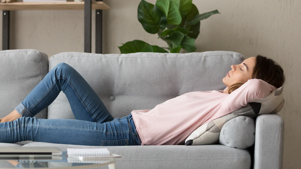 Young woman napping on a couch