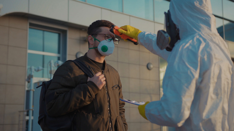 A man gets screened at the airport