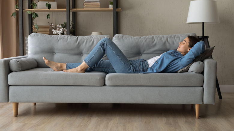 woman napping on couch