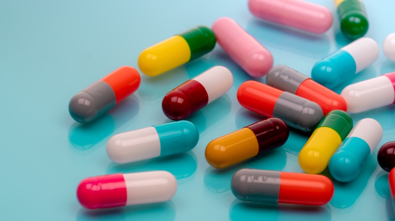 capsule pills on blue background