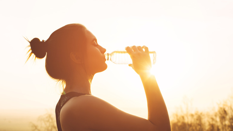 Woman drinking bottled water