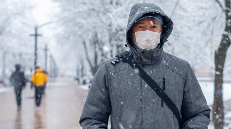 Man wearing mask outdoors