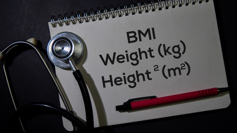 Stethoscope and notepad reading "BMI Weight Height"